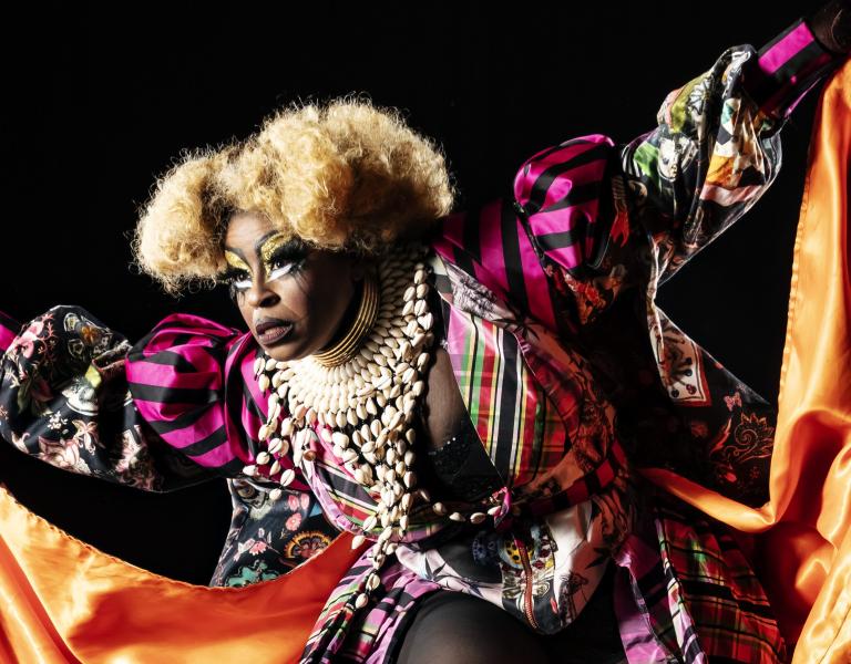 Black Benatar performing in a black box theater