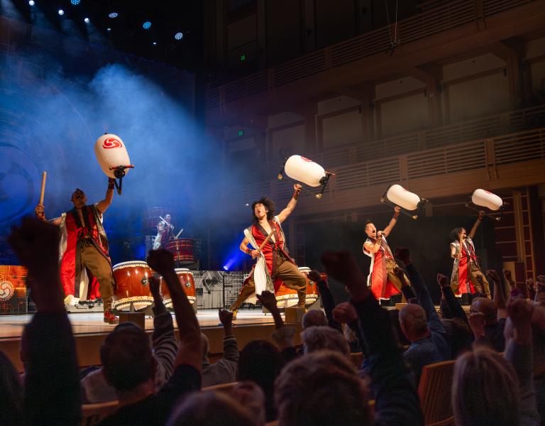 Taiko drummers performing on stage
